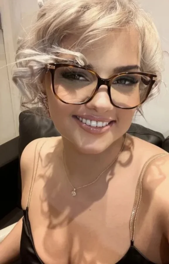 A selfie of a sexy blonde wearing glasses 