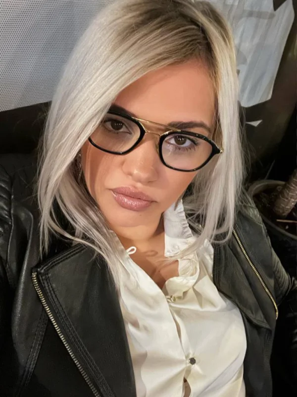Blonde escort Phoenix is wearing glasses in this picture 