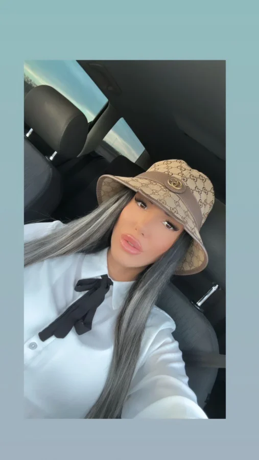 Beautiful escort Lindsey car selfie of her in a hat 