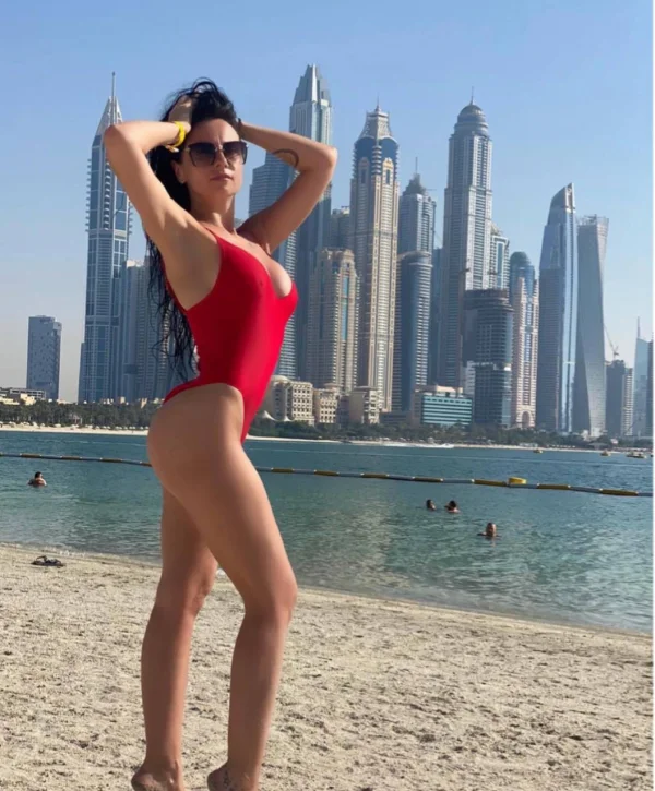 Nina looks very sexy in this red bathing suit 