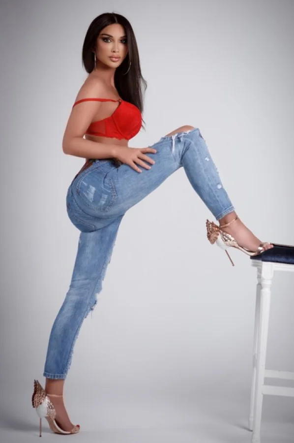 Rosaline is pictured in tight jeans and sexy high heels 