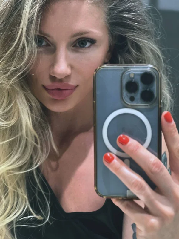 A very close up mirror selfie of a beautiful blonde woman 