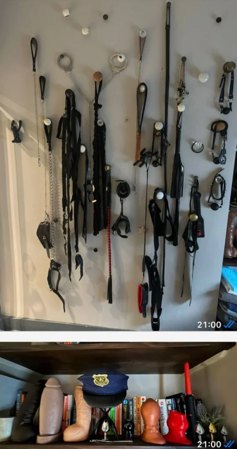 A wall with whips hanging on it 