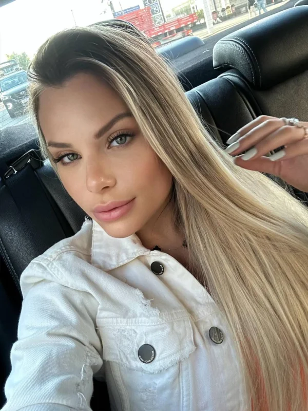 Tallie looks very sexy wearing a white jacket in this selfie 