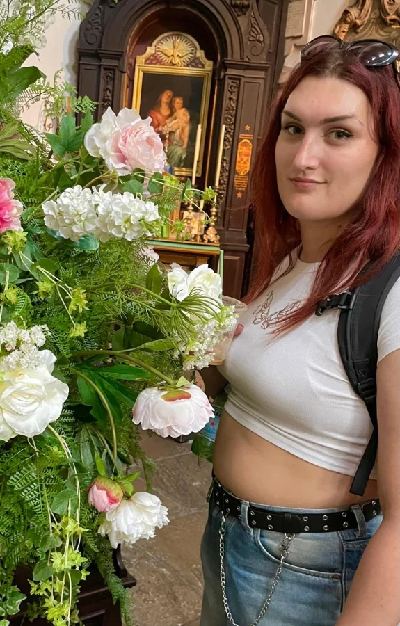 English escort wearing a white crop top 