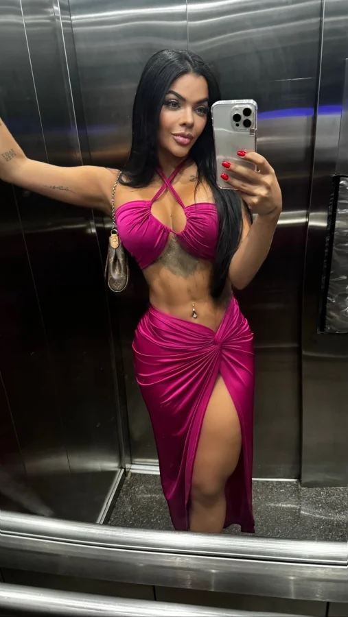 Sexy Brazilian lady with a great figure wearing a revealing dress 