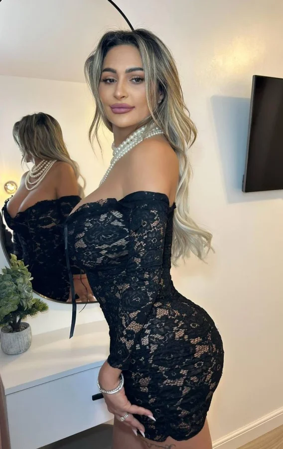 Valeria looks very sexy wearing a black mesh dress 