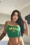 Brazilian escort wearing a white thong and green top 