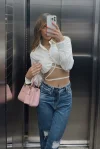 Belmira looks sexy dressed in a white shirt and jeans 